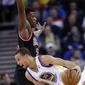 Golden State Warriors&#39; Stephen Curry (30) dribbles around Chicago Bulls&#39; Jimmy Butler during the first half of an NBA basketball game, Thursday, Feb. 6, 2014, in Oakland, Calif. (AP Photo/Marcio Jose Sanchez)