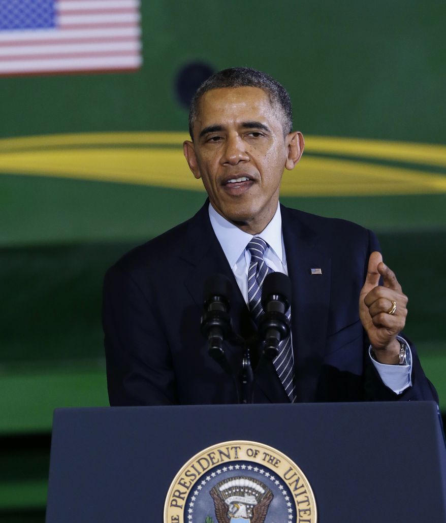 President Barack Obama speaks at Michigan State University in East Lansing, Mich., Friday, Feb. 7, 2014, before signing the farm bill. The president signed into law an agriculture spending bill that will spread benefits to farmers in every region of the country, while trimming the food stamp program that inspired a two-year battle over the legislation. (AP Photo/Carlos Osorio)