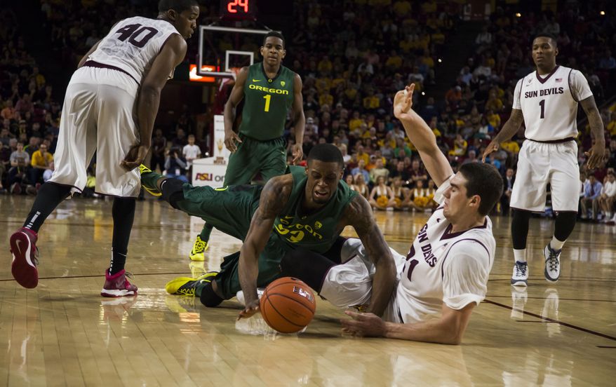 Oregon forward Elgin Cook, front left, is fouled by Arizona State forward Eric Jacobsen during an NCAA college basketball game on Saturday, Feb. 8, 2014, in Tempe, Ariz. (AP Photo/The Arizona Republic, Stacie Scott) MARICOPA COUNTY OUT; NO SALES