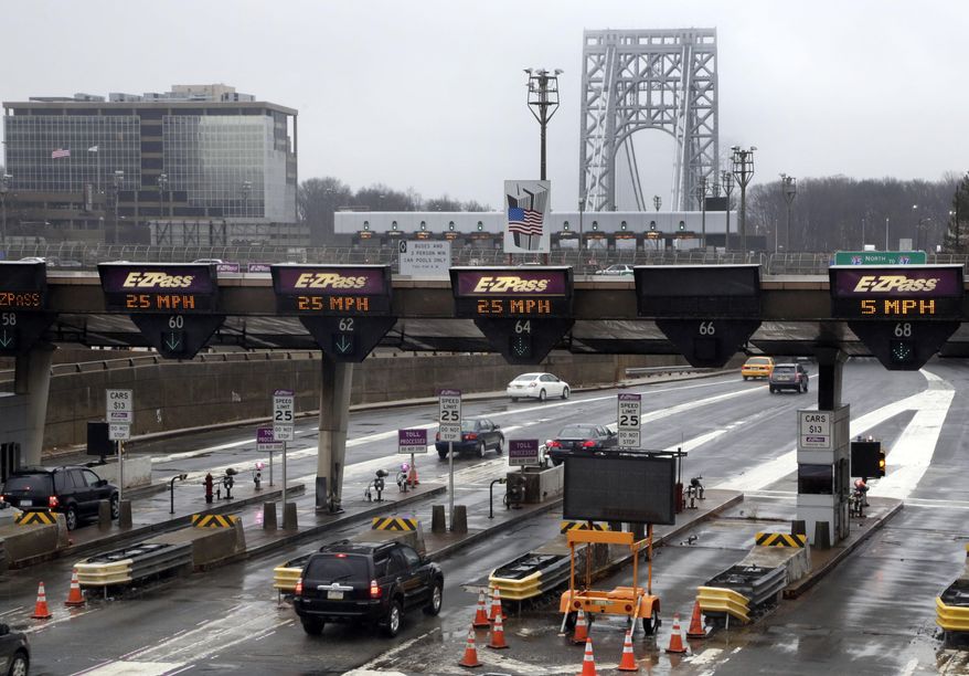 FILE - In this Jan. 11, 2014, file photo, traffic passes through the toll booths at the George Washington Bridge, in Fort Lee, N.J. On paper, David Wildstein's title at the Port Authority of New York and New Jersey was "Director of Interstate Capital Projects." But many who worked there knew his real job, a post created just for him in 2010, was to further Republican Gov. Chris Christie's agenda inside the agency.He led efforts to give New Jersey officials more sway over authority operations. Now, the man who was known as the administration's eyes and ears at the Port Authority may be the public's best chance of knowing the truth behind a plan last summer to purposely create days of traffic gridlock in Fort Lee, N.J., by choking off local access to the George Washington Bridge.(AP Photo/Richard Drew, File)