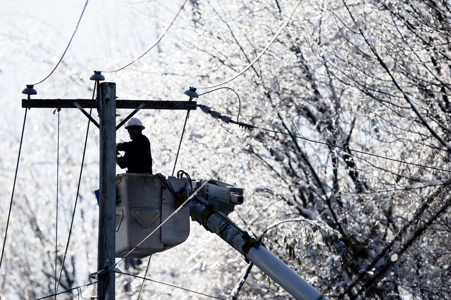 A linesman works to restore electrical power, Friday, Feb. 7, 2014, in Downingtown, Pa. A small army of electricity restoration crews labored Friday to reconnect about 330,000 customers in Pennsylvania and Maryland.  (AP Photo/Matt Rourke)