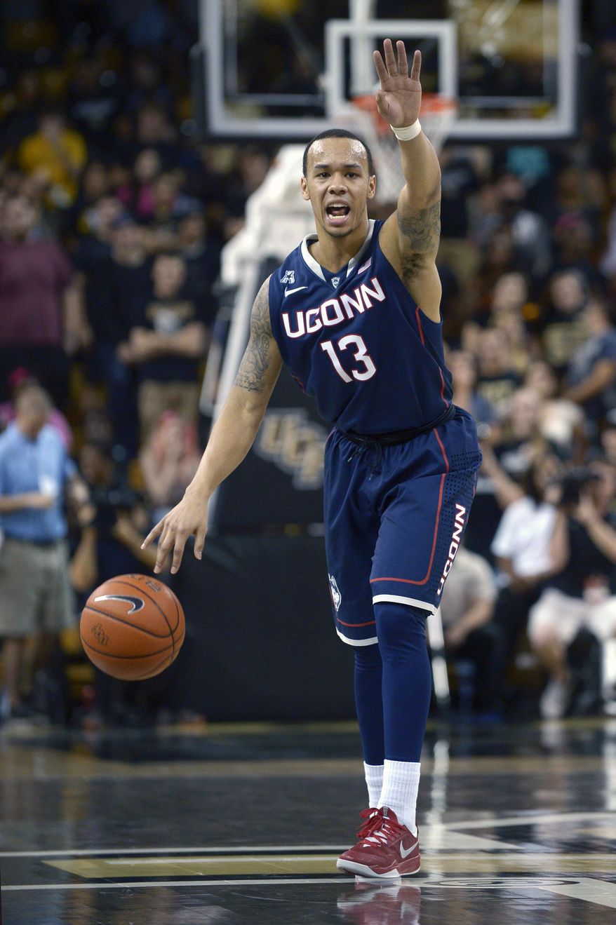 Connecticut guard Shabazz Napier calls out a play during the first half of an NCAA college basketball game against Central Florida in Orlando, Fla., Sunday, Feb. 9, 2014. (AP Photo/Phelan M. Ebenhack)