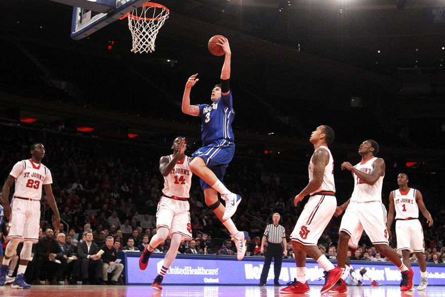 Creighton's Doug McDermott (3) goes to the basket against St. John's during the first half of an NCAA college basketball game, Sunday, Feb. 9, 2014, in New York. (AP Photo/Jason DeCrow)