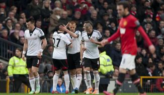 Fulham&#39;s Steve Sidwell, centre, celebrates with teammates after scoring against Manchester United during their English Premier League soccer match at Old Trafford Stadium, Manchester, England, Sunday Feb. 9, 2014. (AP Photo/Jon Super)
