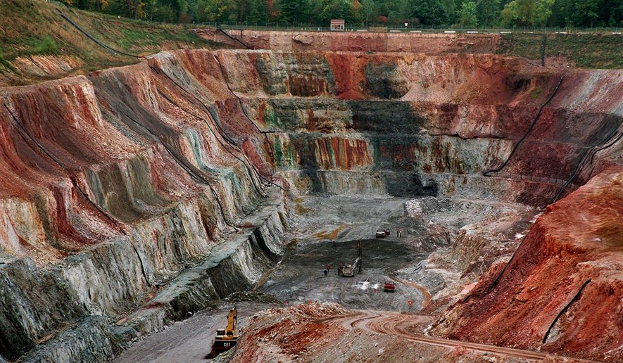 ADVANCE FOR MONDAY FEB. 10, 2014-File - In this September 1996 file photo, the Flambeau open pit copper mine is shown in Ladysmith, Wis. While Minnesota lawmakers debate whether the state of Minnesota should allow PolyMet Mining Corp. to build the state's first copper-nickel mine, the big issue is whether the company can provide sufficient financial assurances to cover the costs for cleaning it up after it closes. The Flambeau Mine, which operated from 1993-97, was filled in, replanted and turned into a park with hiking and horse trails but a lawsuit alleged that it was still leaking pollutants into a river in violation of clean water standards and the company was fined $275 in 2012. (AP Photo/Milwaukee Journal Sentinel/Rick Wood,File)