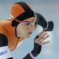 Ireen Wust of the Netherlands, her nails painted in the colors of the Dutch flag, competes in the women&#39;s 3,000-meter speedskating race at the Adler Arena Skating Center during the 2014 Winter Olympics, Sunday, Feb. 9, 2014, in Sochi, Russia. (AP Photo/Matt Dunham)