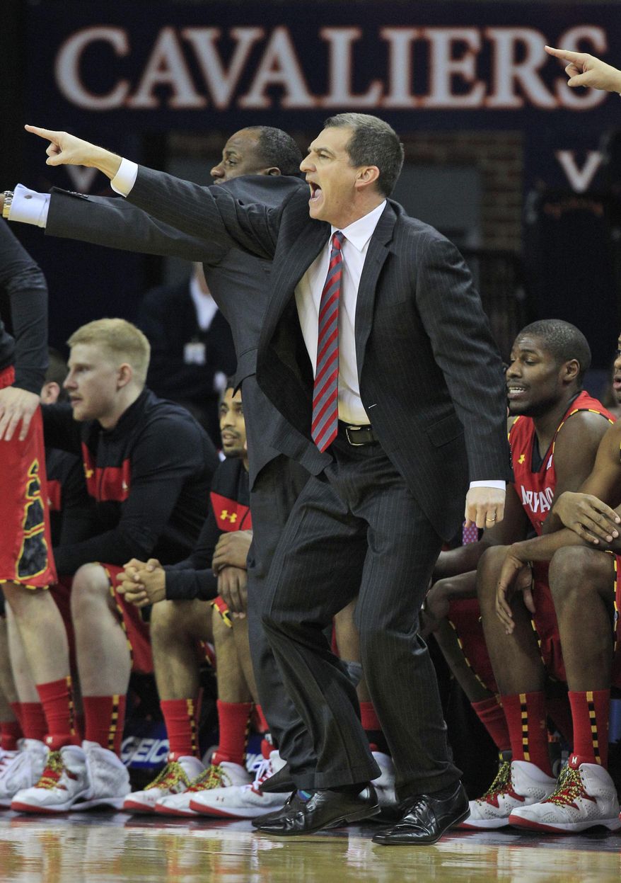 Maryland head coach Mark Turgeon directs his team during the first half of an NCAA college basketball game in Charlottesville, Va., Monday, Feb. 10, 2014. (AP Photo/Steve Helber)