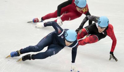 Lee Han-bin of South Korea leads ahead of Michael Gilday of Canada, right, and Dequan Chen of China, back, in a men&#39;s 1500m short track speedskating heat at the Iceberg Skating Palace during the 2014 Winter Olympics, Monday, Feb. 10, 2014, in Sochi, Russia. (AP Photo/Ivan Sekretarev)