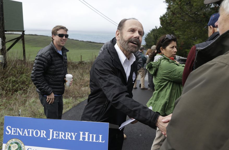 Democratic state Sen. Jerry Hill of San Mateo, shakes hands with a supporter after speaking about a beach access bill he introduced near Martin's Beach Monday, Feb. 10, 2014, in Half Moon Bay, Calif. A bill seeking to re-establish public access to a popular Northern California beach that was closed off after a Silicon Valley billionaire bought the adjacent land was introduced on Monday. Hill said his bill would require the State Lands Commission to negotiate with Sun Microsystems Inc. co-founder Vinod Khosla to purchase some or all of his land at Martin's Beach. (AP Photo/Eric Risberg)