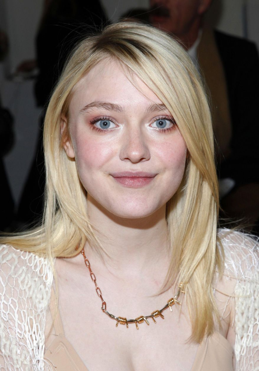 Actress Dakota Fanning attends the Rodarte 2014 Fall/Winter Collection during Mercedes Benz Fashion Week on Tuesday, Feb. 11, 2014, in New York. (Photo by Amy Sussman/Invision/AP)