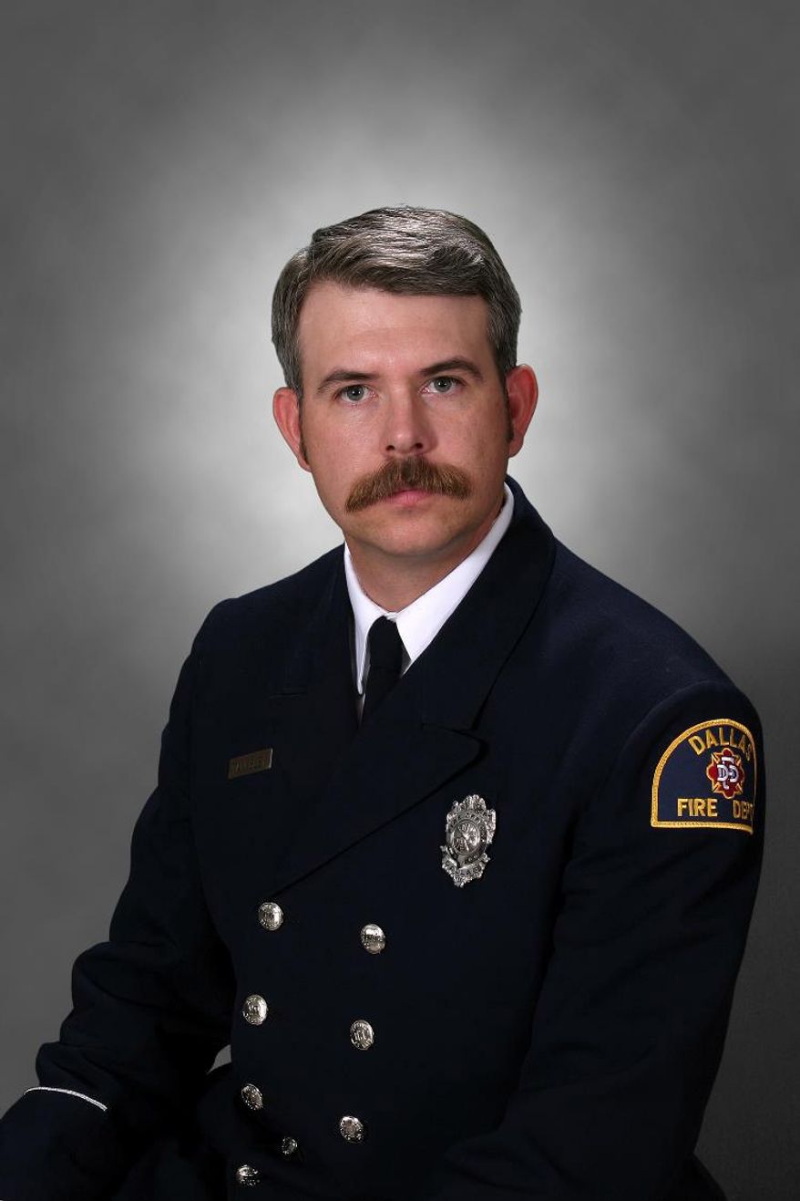 This photo provided by Dallas-Fire Rescue shows Dallas firefighter William Scott Tanksley, 40, who died Monday night, Feb. 10, 2014 after falling from an icy overpass as emergency personnel responded to a traffic accident. (AP Photo/Dallas-Fire Rescue )