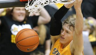 Wichita State&#39;s Ron Baker dunks against Southern Illinois during the first half of an NCAA college basketball game Tuesday, Feb. 11, 2014, in Wichita, Kan. (AP Photo/The Wichita Eagle, Travis Heying) LOCAL TV OUT; MAGS OUT LOCAL RADIO OUT; LOCAL INTERNET OUT