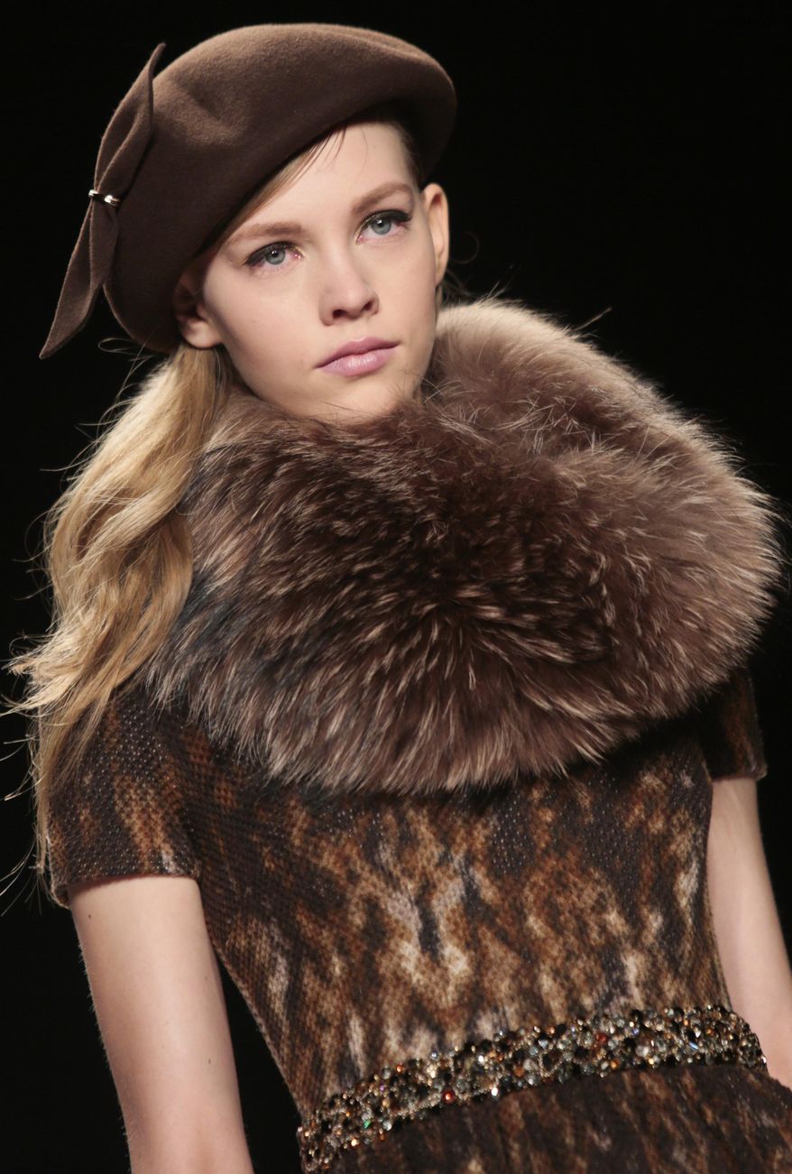 Fashion from the Badgley Mischka Fall 2014 collection is modeled during New York Fashion Week on Tuesday Feb. 11, 2014. (AP Photo/Bebeto Matthews)