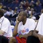 Philadelphia 76ers players watch from the bench in the closing seconds of a 123-80 loss to the Golden State Warriors during the second half of an NBA basketball game on Monday, Feb. 10, 2014, in Oakland, Calif. (AP Photo/Marcio Jose Sanchez)