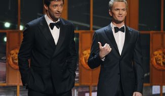 FILE - This June 12, 2011 file photo shows Hugh Jackman, left, and host Neil Patrick Harris performing during the 65th annual Tony Awards in New York. Producers of the annual telecast celebrating the best of Broadway said Tuesday, Feb. 11, 2014, that Jackman will once again take up hosting duties for the next awards on June 8 at Radio City Music Hall. It will be Jackman’s fourth time hosting the Tonys. Last year&#39;s telecast saw viewership jump to 7.24 million people, the show&#39;s largest audience in four years. Harris hosted for the fourth time but he’ll be on Broadway this spring in “Hedwig and the Angry Inch.” (AP Photo/Jeff Christensen)