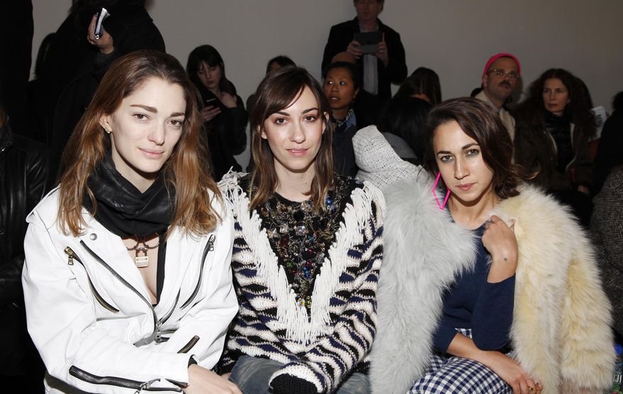 Sophia Sanchez, from left, Gia Coppola and Delfina Delettrez Fendi attend the Rodarte 2014 Fall/Winter Collection during Mercedes Benz Fashion Week on Tuesday, Feb. 11, 2014, in New York. (Photo by Amy Sussman/Invision/AP)