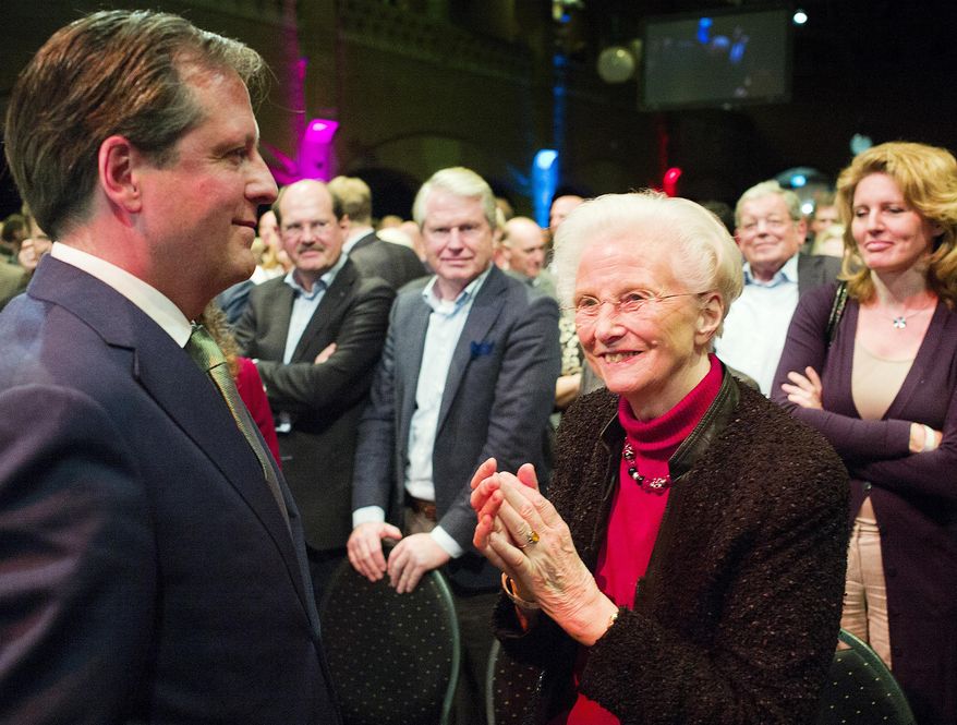 In this photo taken Saturday, Feb. 8, 2014, Els Borst, front right, applauds after a speech from Alexander Pechtold, front left, during a D66 party congress in Amsterdam. Els Borst, a former health minister who drafted the Netherlands' 2002 law permitting euthanasia, has been found dead in her garage on Monday night, police said Tuesday, Feb. 11, 2014. She was 81. Utrecht police spokesman Thomas Aling told state broadcaster NOS that police had not ruled out a natural cause of death, an accident or a crime, but had no reason to suspect a crime. She is survived by three children. (AP Photo/Jiri Buller)