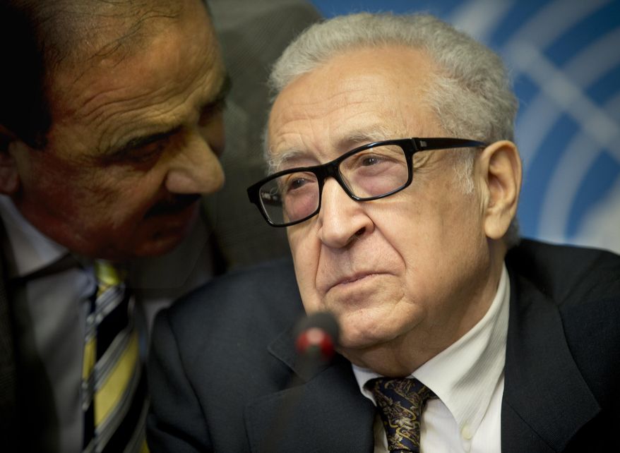U.N. mediator Lakhdar Brahimi, right, gets information from an aide prior to a press briefing at the United Nations headquarters in Geneva, Switzerland, Switzerland, Tuesday, Feb 11, 2014. A second round of peace talks between the Syrian government and the opposition bogged down quickly Tuesday in recriminations about who was responsible for escalating violence that has killed hundreds in the past few days and disrupted food aid for trapped civilians. (AP Photo/Anja Niedringhaus)