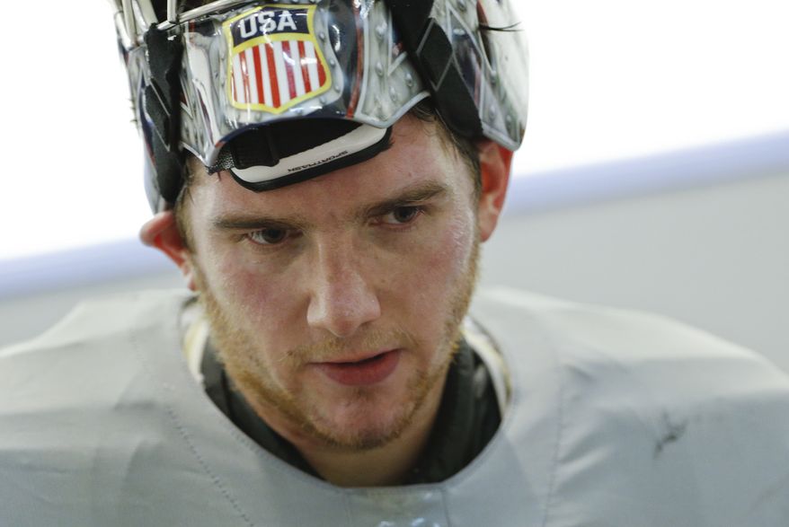 USA goaltender Jonathan Quick skates off the ice after a training session at the Bolshoy Ice Dome at the the 2014 Winter Olympics, Tuesday, Feb. 11, 2014, in Sochi, Russia. (AP Photo/Julio Cortez)