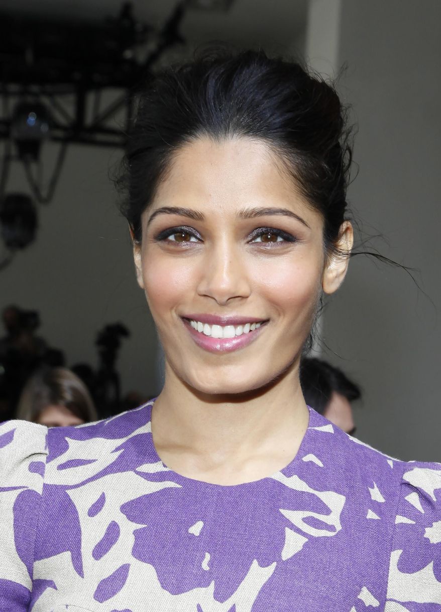 Actress Freida Pinto attends the Michael Kors 2014 Fall/Winter Collection during Mercedes Benz Fashion Week on Wednesday, Feb. 12, 2014, in New York. (Photo by Amy Sussman/Invision/AP)