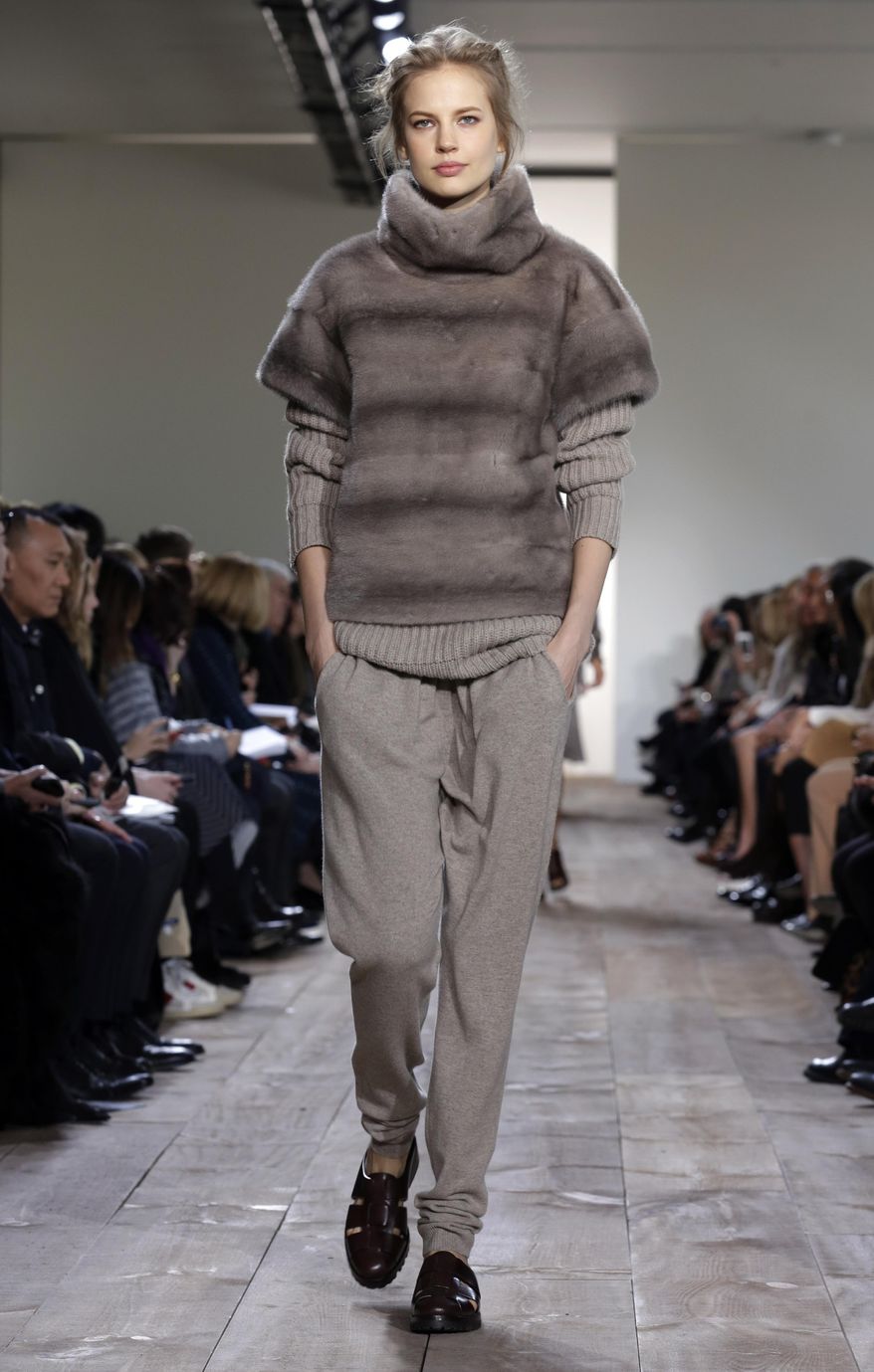 The Michael Kors Fall 2014 collection is modeled during Fashion Week in New York, Wednesday, Feb. 12, 2014. (AP Photo/Richard Drew)