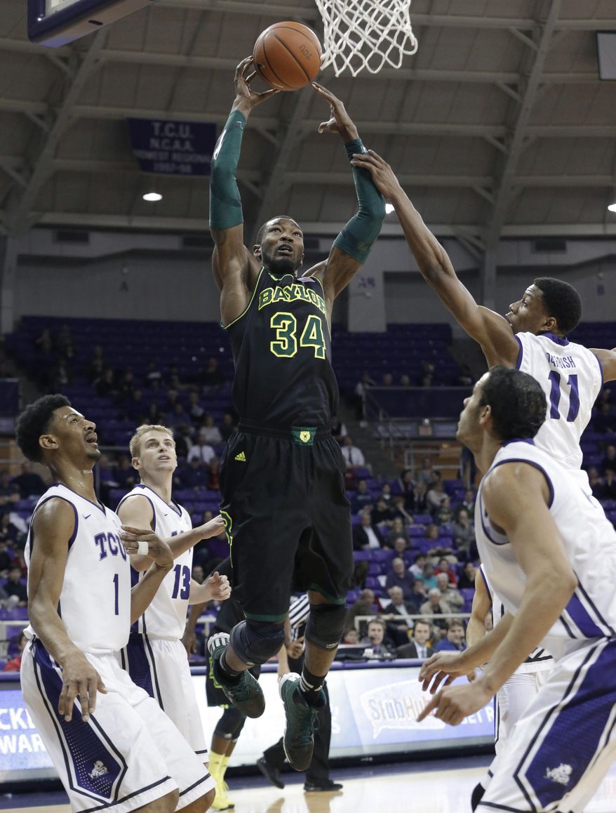 Baylor forward Cory Jefferson (34) shoots against TCU's Karviar Shepherd (1), Brandon Parrish (11) and Christian Gore (13) during the first half of an NCAA college basketball game Wednesday, Feb. 12, 2014, in Fort Worth, Texas. (AP Photo/LM Otero)