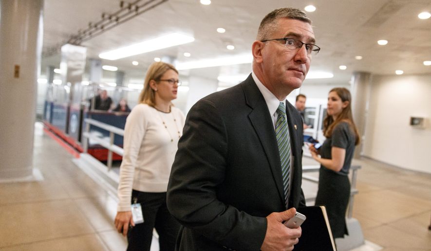 Sen. John Walsh, Montana Democrat, cast a vote in favor of raising the debt ceiling in his first full day on the job on Wednesday. (Associated Press)