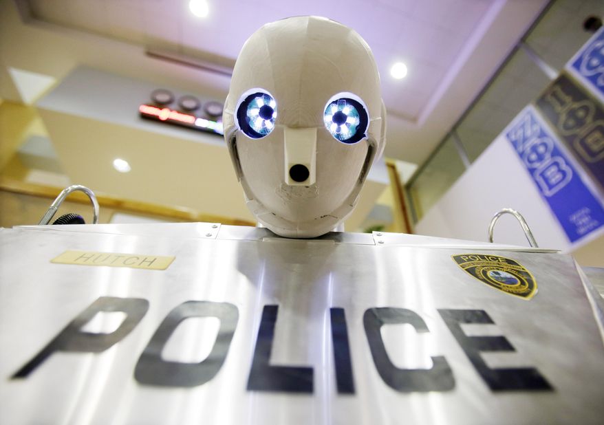 A TeleBot, which combines telepresence and robotics is shown during a demonstration at Florida International University, Wednesday, Feb. 12, 2014 in Miami. A group of students at FIU's Discovery Lab is testing their version of a RoboCop that will allow disabled police and military personnel to serve as patrol officers. The Telebot has two high definition web cameras in its eyes to generate a live, three-dimensional view. (AP Photo/Wilfredo Lee)