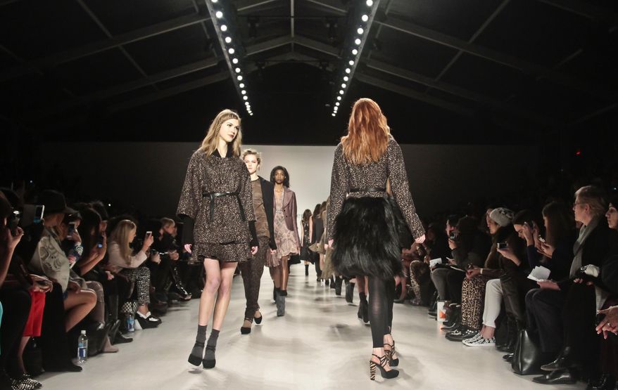 Fashion from the Nanette Lepore Fall 2014 collection is modeled during New York Fashion Week on Wednesday Feb. 12, 2014. (AP Photo/Bebeto Matthews)