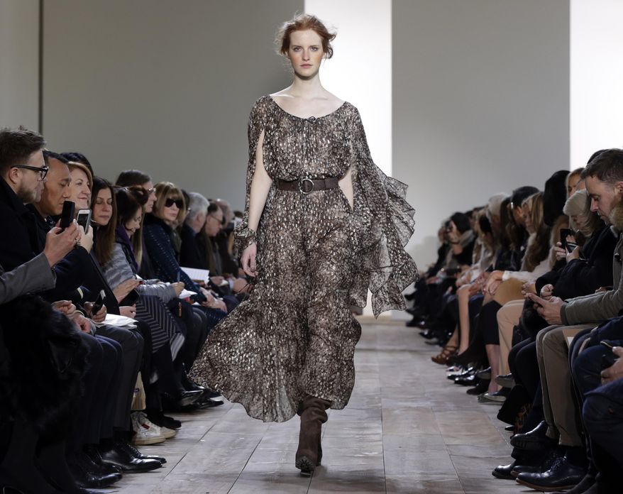 The Michael Kors Fall 2014 collection is modeled during Fashion Week in New York, Wednesday, Feb. 12, 2014. (AP Photo/Richard Drew)