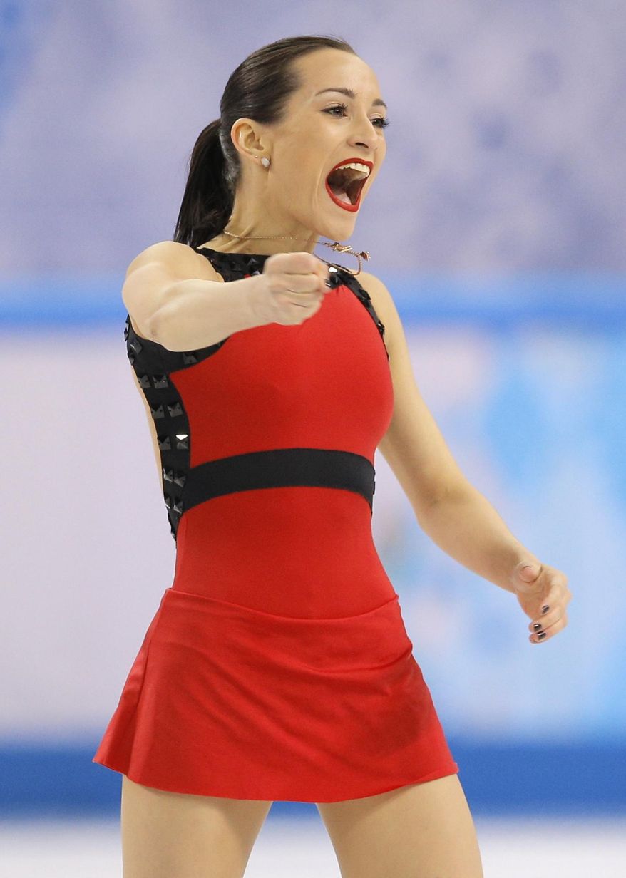 Ksenia Stolbova reacts as she and Fedor Klimov of Russia complete their routine in the pairs free skate figure skating competition at the Iceberg Skating Palace during the 2014 Winter Olympics, Wednesday, Feb. 12, 2014, in Sochi, Russia. (AP Photo/Vadim Ghirda)
