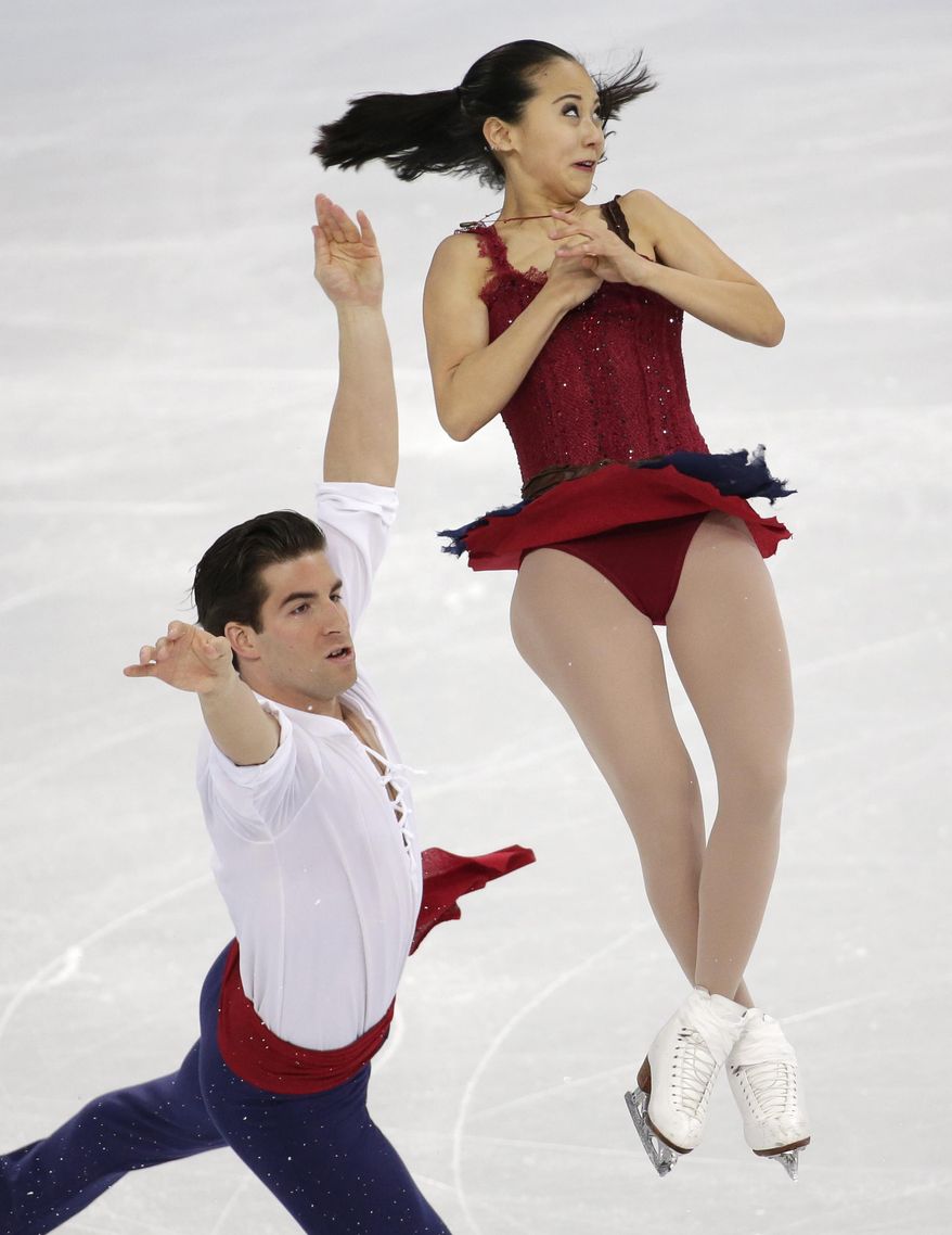 Felicia Zhang and Nathan Bartholomay of the United States compete in the pairs free skate figure skating competition at the 2014 Winter Olympics, Wednesday, Feb. 12, 2014, in Sochi, Russia. (AP Photo/Bernat Armangue)