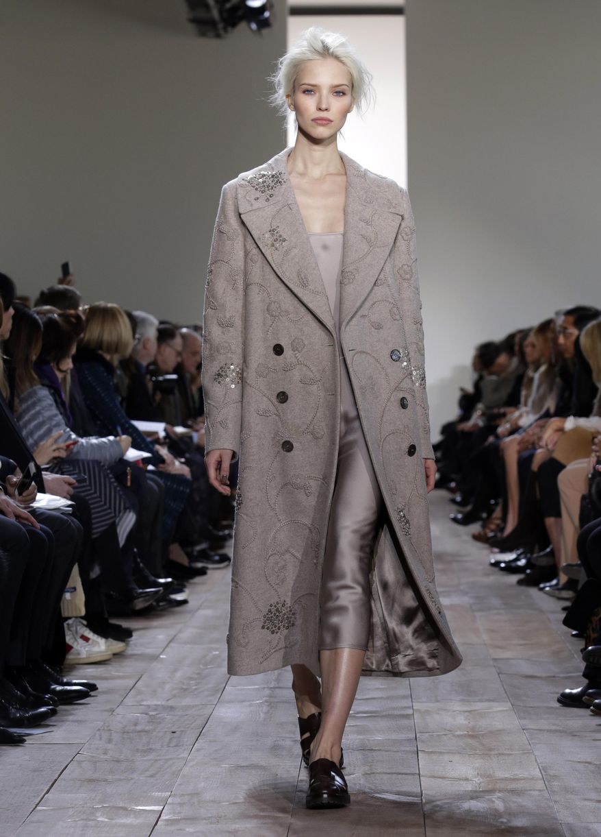 The Michael Kors Fall 2014 collection is modeled during Fashion Week in New York, Wednesday, Feb. 12, 2014. (AP Photo/Richard Drew)