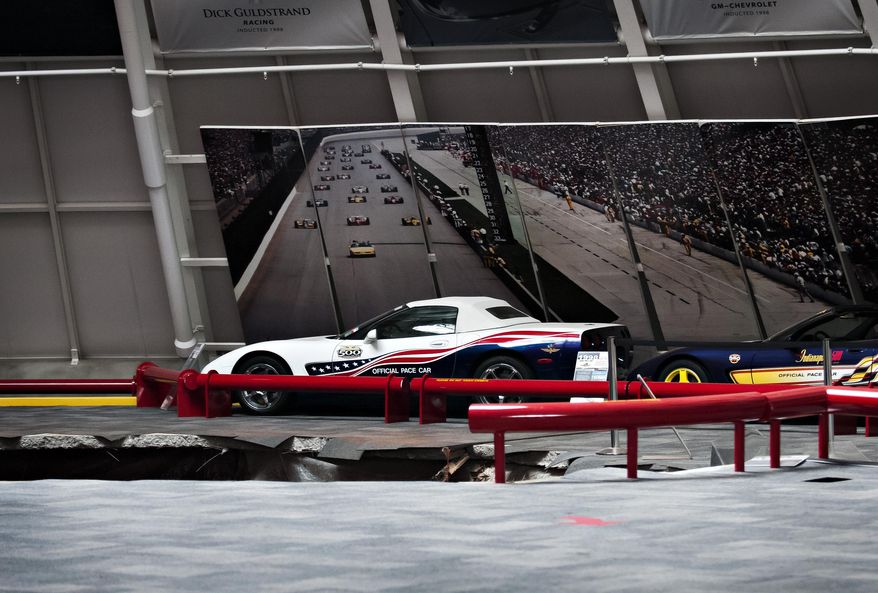 A sinkhole opened up in the dome showroom, Wednesday, Feb. 12, 2014, in Bowling Green, Ky.m at the National Corvette Museum swallowing eight car. (AP Photo/Miranda Pederson, Daily News)