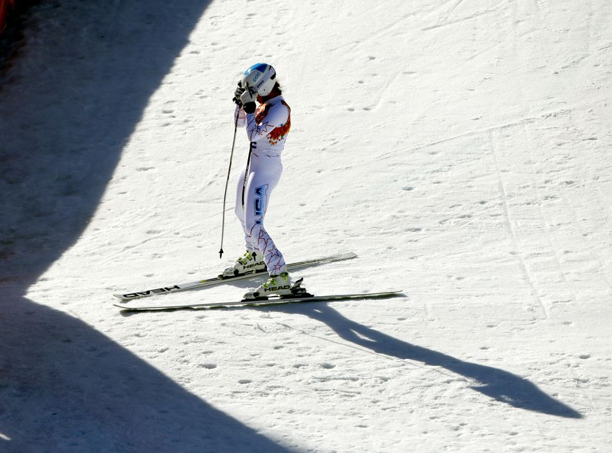 United States' Julia Mancuso reacts after her run in the women's downhill at the 2014 Winter Olympics, Wednesday, Feb. 12, 2014, in Krasnaya Polyana, Russia. (AP Photo/Charlie Riedel)