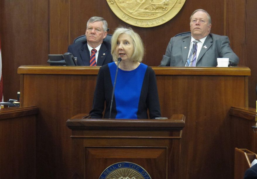 Dana Fabe, the chief justice of the Alaska Supreme Court, delivers the State of the Judiciary address to a joint session of the Alaska Legislature on Wednesday, Feb. 12, 2014, in Juneau, Alaska. Shown behind her are Senate President Charlie Huggins, left, and House Speaker Mike Chenault, right. (AP Photo/Becky Bohrer)