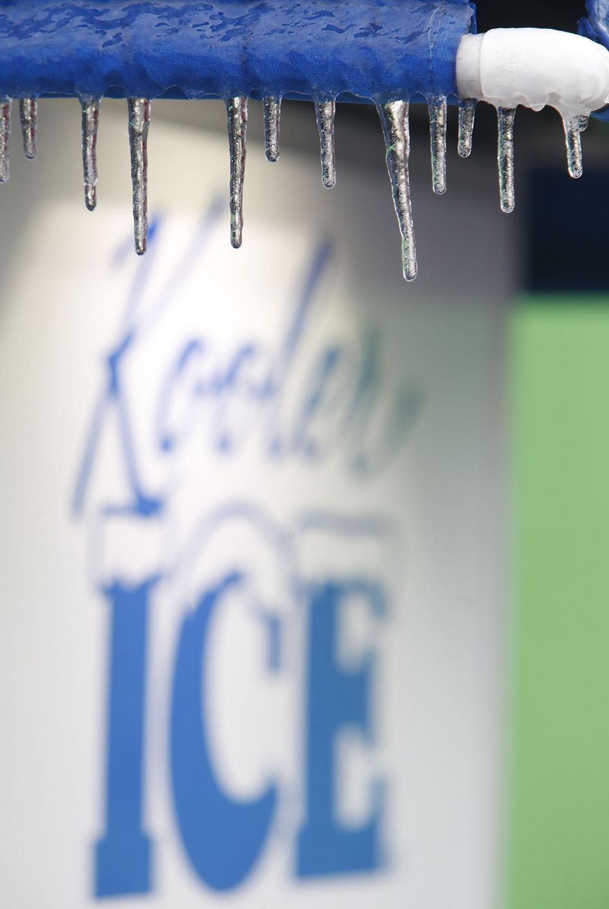 Ice hangs from an ice machine Wednesday Feb. 12, 2014 in Fort Payne Ala. A winter storm warning covered almost the entire northern half of the state, and many schools and businesses were closed or opened late. (AP Photo/Hal Yeager)