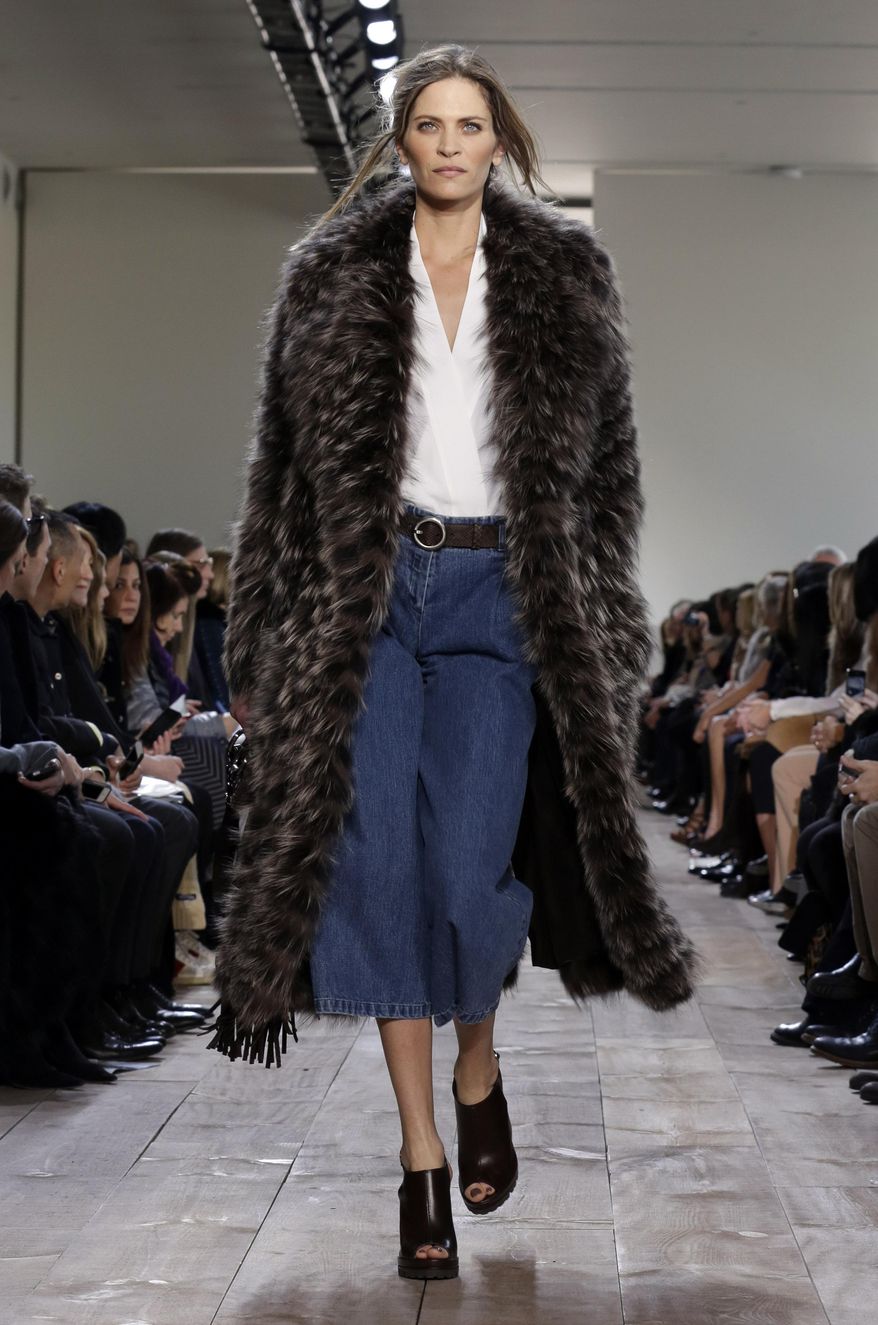 The Michael Kors Fall 2014 collection is modeled during Fashion Week in New York, Wednesday, Feb. 12, 2014. (AP Photo/Richard Drew)