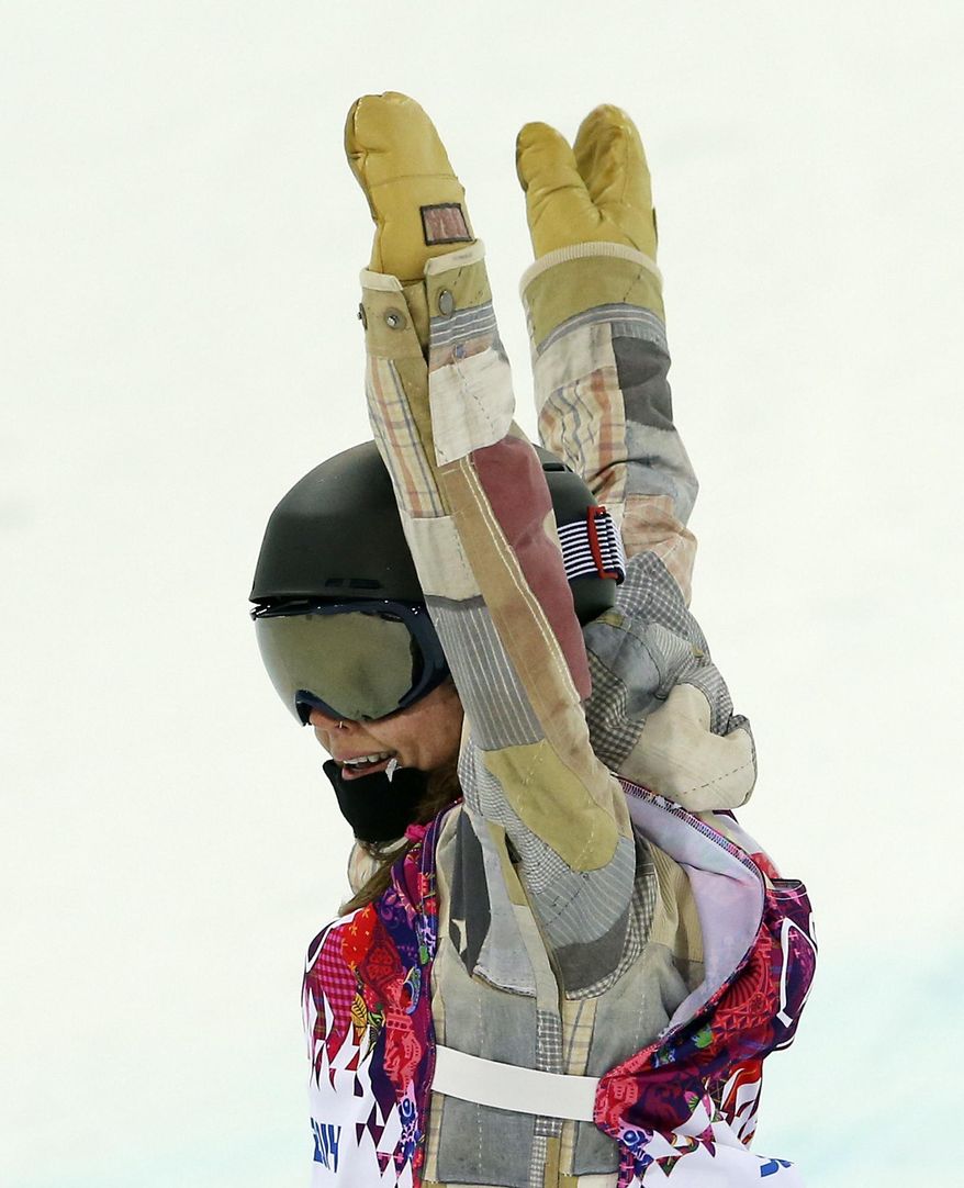 United States' Kaitlyn Farrington reacts after her second run during the women's snowboard halfpipe final at the Rosa Khutor Extreme Park, at the 2014 Winter Olympics, Wednesday, Feb. 12, 2014, in Krasnaya Polyana, Russia. (AP Photo/Sergei Grits)
