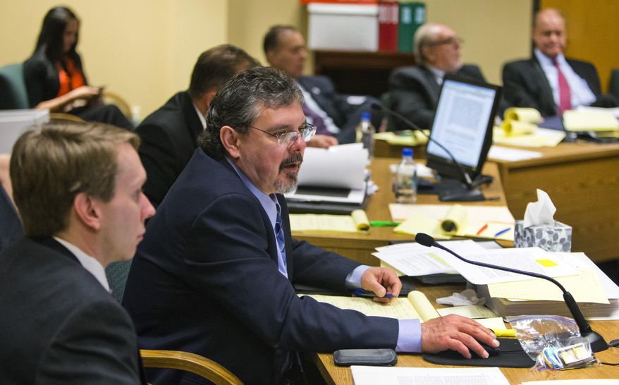Yavapai County Deputy County Attorney Jack Fields, second from left, questions Arizona Attorney General Tom Horne's current aide Kathleen Winn during a hearing on possible campaign finance law violations on Wednesday, Feb. 12, 2013, in Phoenix, Ariz. Horne said Wednesday he "absolutely never" had illegal communications with the leader of an independent campaign backing him during his 2010 election bid. (AP Photo/The Arizona Republic, Tom Tingle)  MARICOPA COUNTY OUT; MAGS OUT; NO SALES