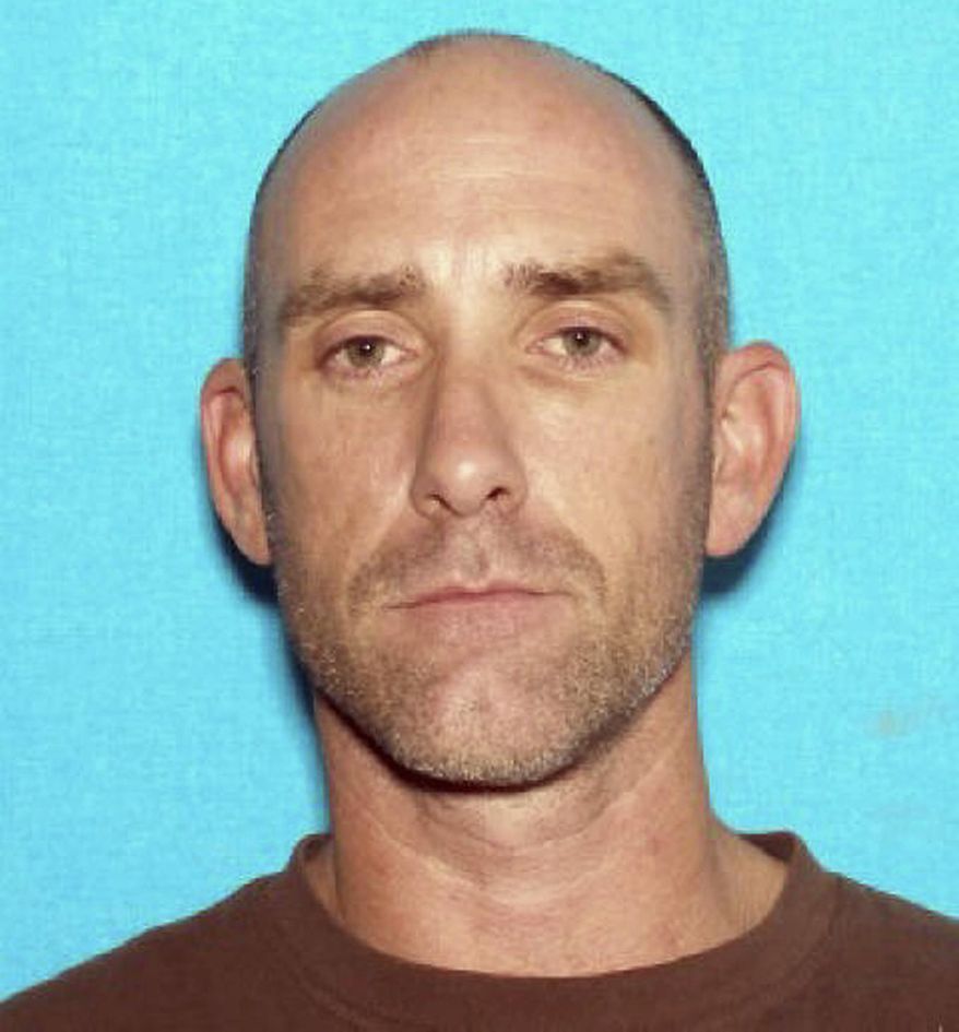 FILE - This undated image provided by the Mesquite Police Department shows Daniel Runyon. Sentencing was postponed Wednesday Feb. 12, 2014, in Las Vegas for Runyon, an ex-convict from Utah who pleaded guilty to a firearm charge in a shootout that left a police officer injured last year in the resort city of Mesquite, Nev.. (AP Photo/Mesquite Police Department, file)