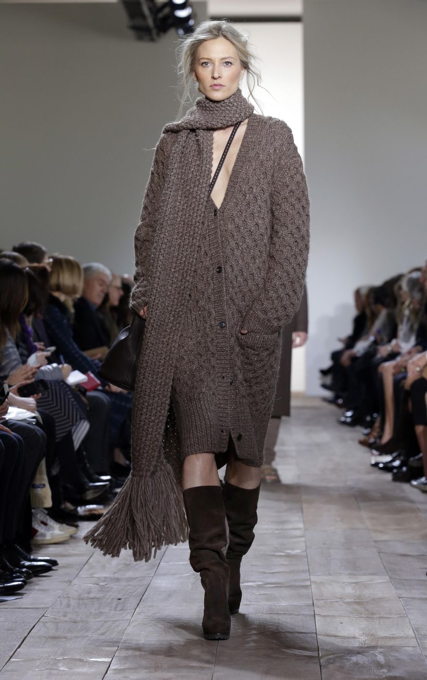 The Michael Kors Fall 2014 collection is modeled during Fashion Week in New York, Wednesday, Feb. 12, 2014. (AP Photo/Richard Drew)