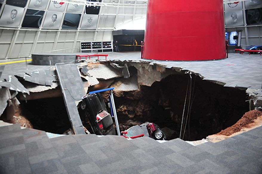 Several cars collapsed into a sinkhole on Feb. 12 at the National Corvette Museum in Bowling Green, Ky. The museum said a total of eight cars were damaged when the sinkhole opened up inside the museum. (Associated Press/National Corvette Museum)