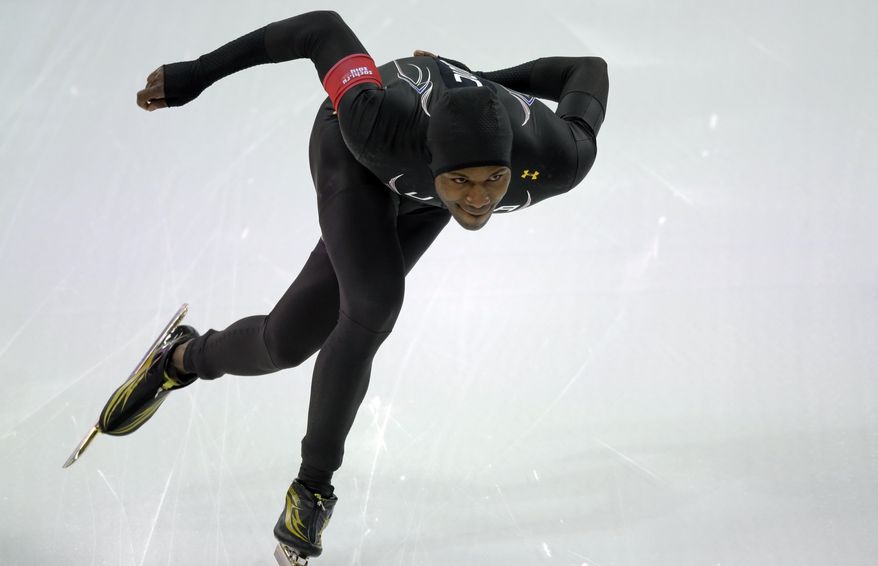 Shani Davis of the U.S. competes during the men's 1,000-meter speedskating race at the Adler Arena Skating Center during the 2014 Winter Olympics in Sochi, Russia, Wednesday, Feb. 12, 2014. (AP Photo/David J. Phillip )