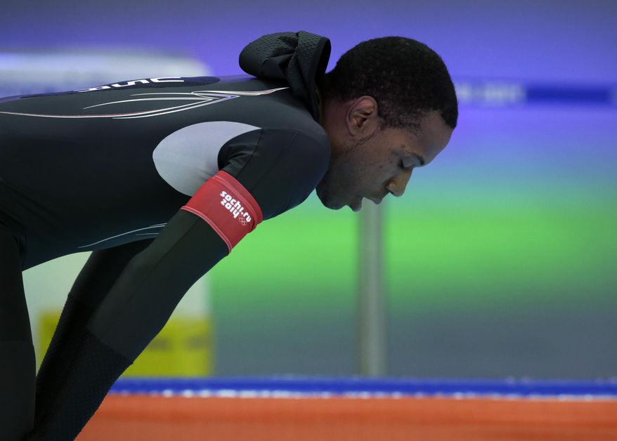 Shani Davis of the U.S. takes a breather after competing in the men's 1,000-meter speedskating race at the Adler Arena Skating Center during the 2014 Winter Olympics in Sochi, Russia, Wednesday, Feb. 12, 2014. (AP Photo/Matt Dunham)
