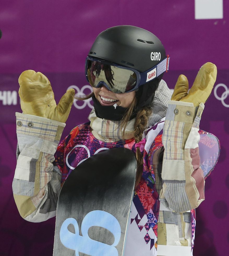 United States' Kaitlyn Farrington reacts after her second run during the women's snowboard halfpipe final at the Rosa Khutor Extreme Park, at the 2014 Winter Olympics, Wednesday, Feb. 12, 2014, in Krasnaya Polyana, Russia. (AP Photo/Sergei Grits)