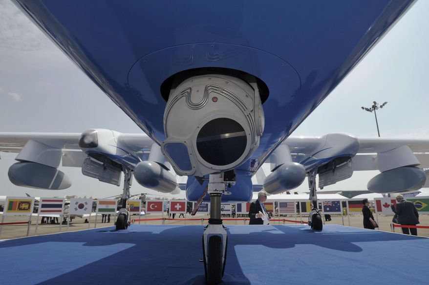 In this Feb. 12, 2014 photo, Israel Aviation Industries Ltd., or IAI Super Heron HF Unmanned Aerial Vehicle sits on display at the Singapore Airshow in Singapore. IAI unveiled its Superheron drone, an upgraded version of its popular Heron. Israel has overtaken the U.S. as the world’s largest exporter of unmanned aerial systems, selling $4.6 billion worth from 2005 to 2012, according to a report by consulting firm Frost & Sullivan. In the same period, U.S. overseas sales amounted to $2-$3 billion. Generals shopping at Asia's biggest defense expo this week have drones high on their to-buy list. (AP Photo/Joseph Nair)