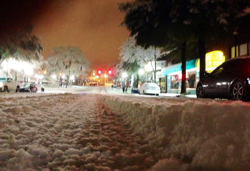 Snow blankets a street in downtown Birmingham, Ala., on Wednesday, Feb. 12, 2014. Snow and ice covered the northern half of the state, forcing authorties to close roads and prompting another day of school and business closings. (AP Photo/Jay Reeves)