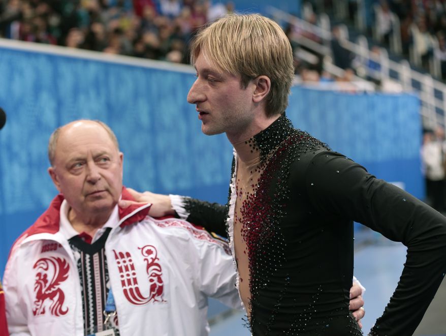 Evgeni Plushenko of Russia, right, and his coach Alexei Mishin leave after Plushenko pulled out of the men's short program figure skating competition due to illness at the Iceberg Skating Palace during the 2014 Winter Olympics, Thursday, Feb. 13, 2014, in Sochi, Russia. (AP Photo/Ivan Sekretarev)