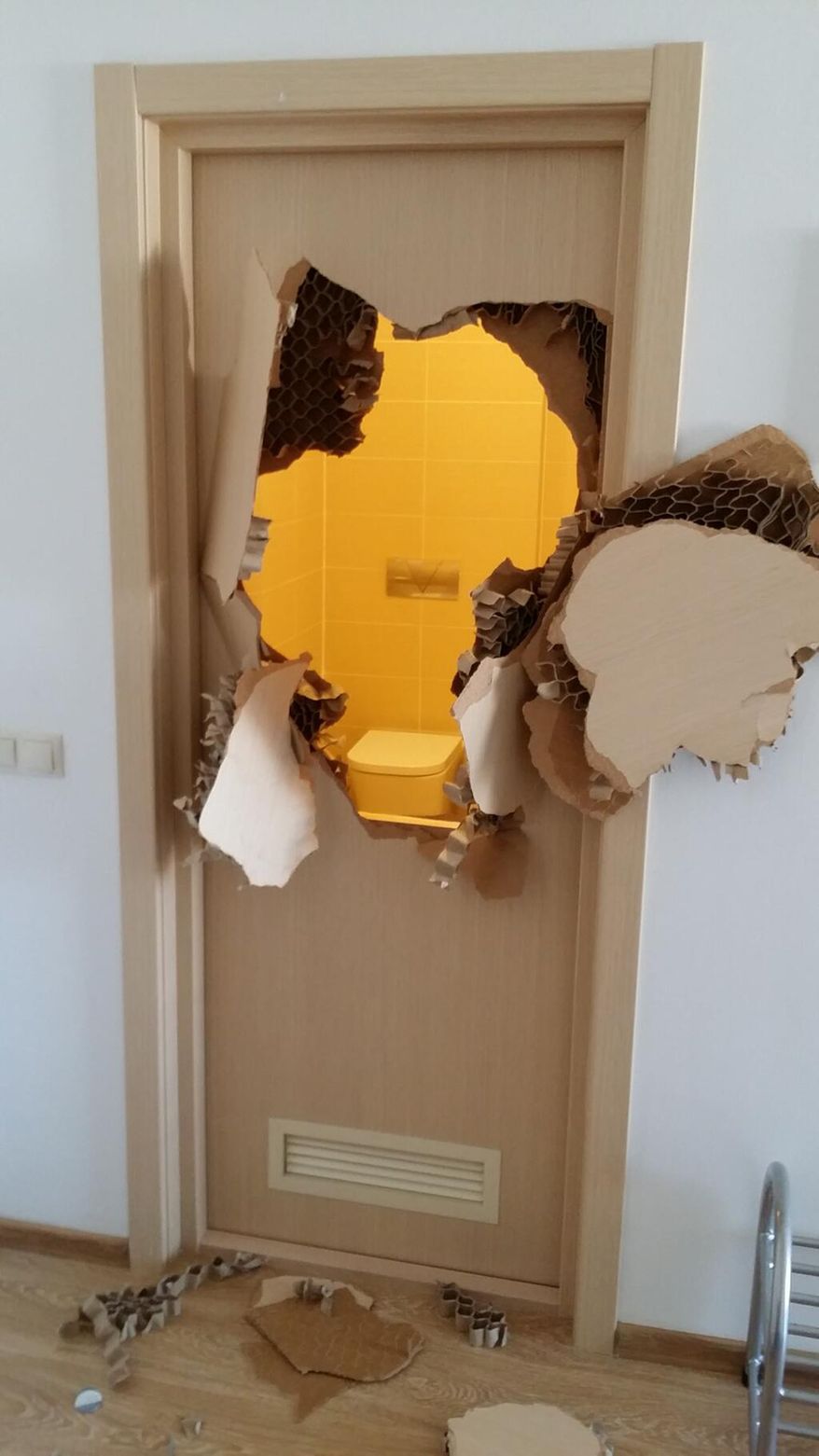 This photo provided by bobsledder Johnny Quinn of the United States shows a door he broke through after realizing he was locked in a bathroom inside the athlete's village, during the 2014 Winter Olympics, in Sochi, Russia. An unknown during stints in the NFL with Green Bay and Buffalo, Quinn literally burst onto the world's stage last week after he tweeted the photo on Feb. 8, 2014. (AP Photo/Johnny Quinn)